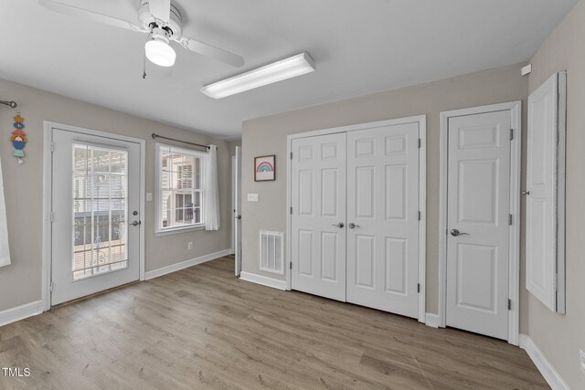 5412 Farley Dr, Raleigh, NC 27609 - unfurnished bedroom with access to exterior, wood finished floors, ceiling fan, and a closet