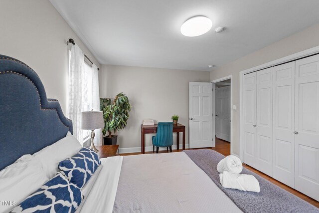 5412 Farley Dr, Raleigh, NC 27609 - bedroom featuring wood finished floors and a closet