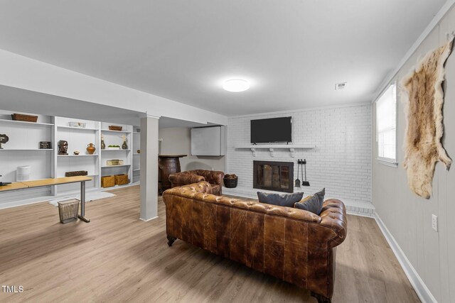 5412 Farley Dr, Raleigh, NC 27609 - living area featuring light wood-type flooring and a fireplace