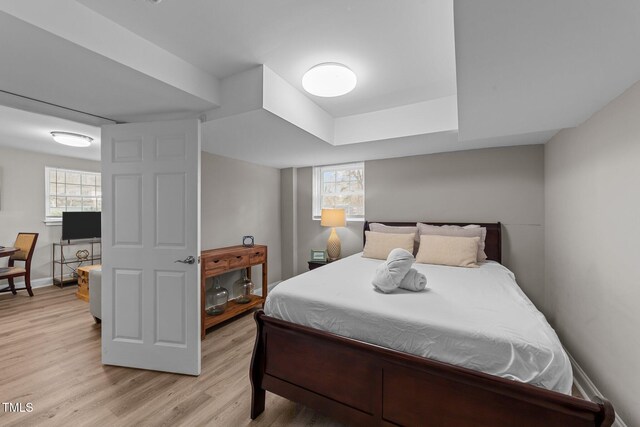 5412 Farley Dr, Raleigh, NC 27609 - bedroom featuring light wood-style floors and baseboards
