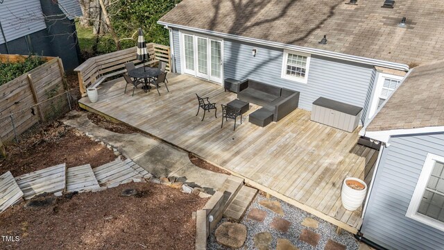 5412 Farley Dr, Raleigh, NC 27609 - wooden terrace featuring outdoor dining area, outdoor lounge area, and french doors