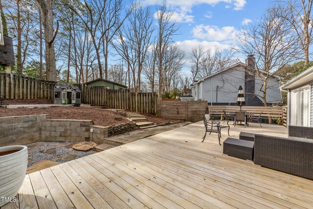 5412 Farley Dr, Raleigh, NC 27609 - wooden deck with a fenced backyard and outdoor dining space
