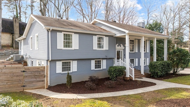5412 Farley Dr, Raleigh, NC 27609 - bi-level home featuring brick siding, a chimney, and a gate