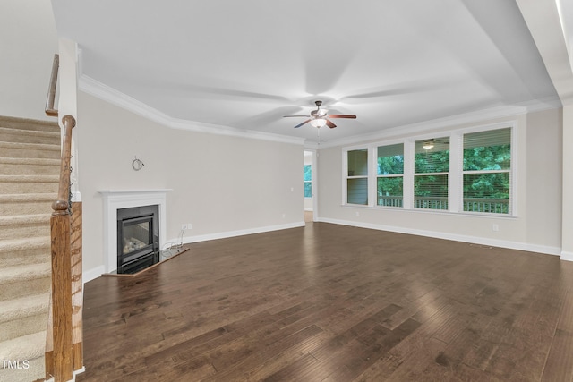216 Pondside Dr, Apex, NC 27539 - unfurnished living room featuring stairway, ceiling fan, dark wood-style flooring, a glass covered fireplace, and ornamental molding