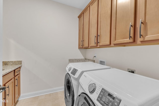 216 Pondside Dr, Apex, NC 27539 - laundry room featuring separate washer and dryer, cabinet space, baseboards, and light tile patterned flooring