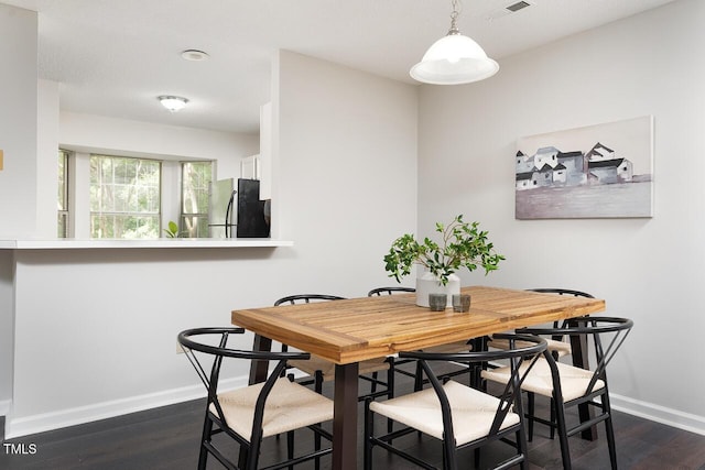 105 Sir Richard Ln, Chapel Hill, NC 27517 - dining area with baseboards and dark wood finished floors