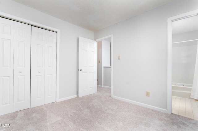 105 Sir Richard Ln, Chapel Hill, NC 27517 - unfurnished bedroom featuring carpet floors, a closet, a textured ceiling, and ensuite bathroom