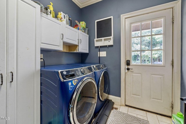 4720 Yates Mill Pond Rd, Raleigh, NC 27606 - laundry room featuring cabinet space, washing machine and clothes dryer, light tile patterned flooring, baseboards, and crown molding