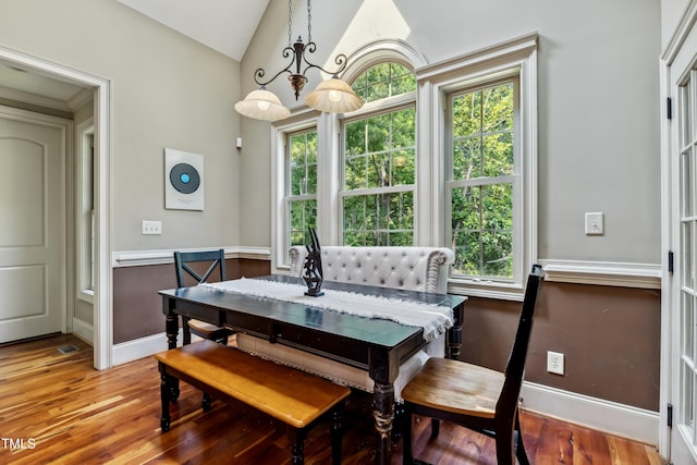 4720 Yates Mill Pond Rd, Raleigh, NC 27606 - dining space featuring vaulted ceiling, wood finished floors, and baseboards