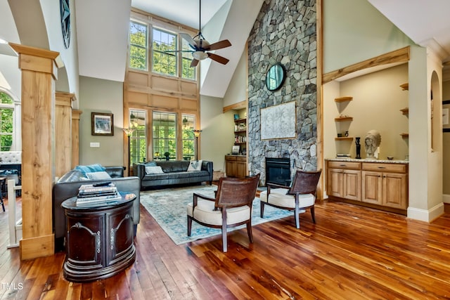 4720 Yates Mill Pond Rd, Raleigh, NC 27606 - living room with ceiling fan, wood-type flooring, a fireplace, high vaulted ceiling, and healthy amount of natural light
