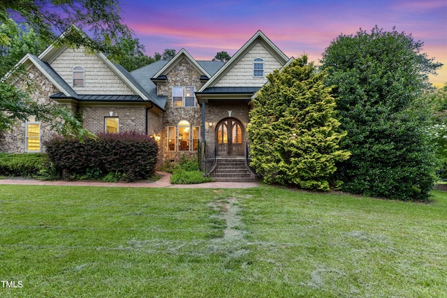 4720 Yates Mill Pond Rd, Raleigh, NC 27606 - view of front of home with a lawn, stone siding, and brick siding