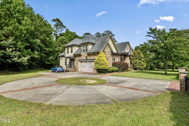 4720 Yates Mill Pond Rd, Raleigh, NC 27606 - view of front of house with driveway, stone siding, a front yard, and an attached garage