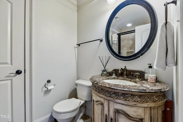 4720 Yates Mill Pond Rd, Raleigh, NC 27606 - full bathroom featuring crown molding, toilet, vanity, tiled shower, and baseboards
