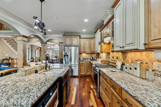 4720 Yates Mill Pond Rd, Raleigh, NC 27606 - kitchen with decorative columns, stainless steel appliances, arched walkways, a sink, and crown molding