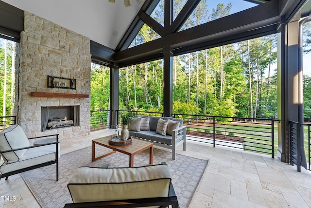 15517 Possum Track Rd, Raleigh, NC 27614 - sunroom / solarium featuring an outdoor living space with a fireplace, lofted ceiling, and ceiling fan