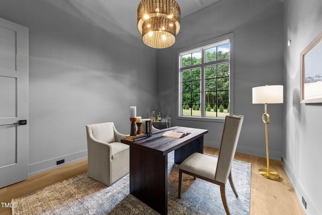 15517 Possum Track Rd, Raleigh, NC 27614 - office with wood finished floors, baseboards, and a chandelier