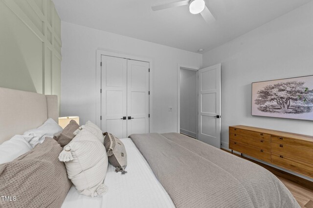 15517 Possum Track Rd, Raleigh, NC 27614 - bedroom with a closet, wood finished floors, and a ceiling fan
