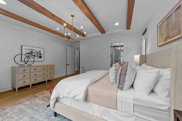15517 Possum Track Rd, Raleigh, NC 27614 - bedroom with beam ceiling, a chandelier, wood finished floors, recessed lighting, and baseboards