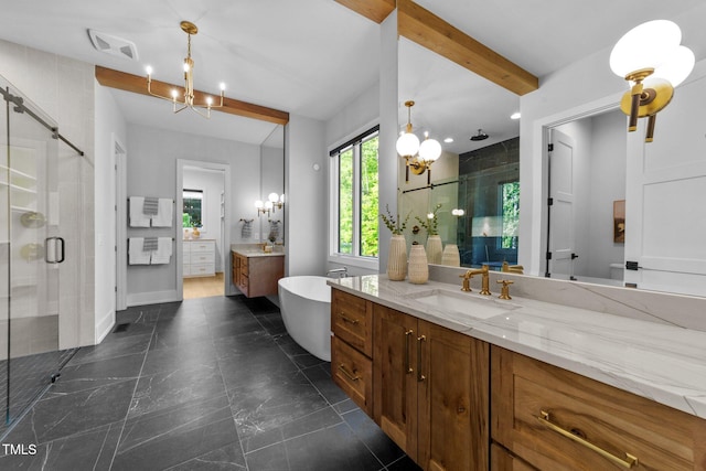 15517 Possum Track Rd, Raleigh, NC 27614 - bathroom featuring a stall shower, two vanities, a freestanding bath, a chandelier, and beam ceiling