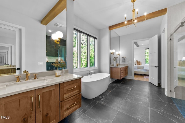 15517 Possum Track Rd, Raleigh, NC 27614 - full bath with plenty of natural light, two vanities, a freestanding bath, beamed ceiling, and ensuite bathroom