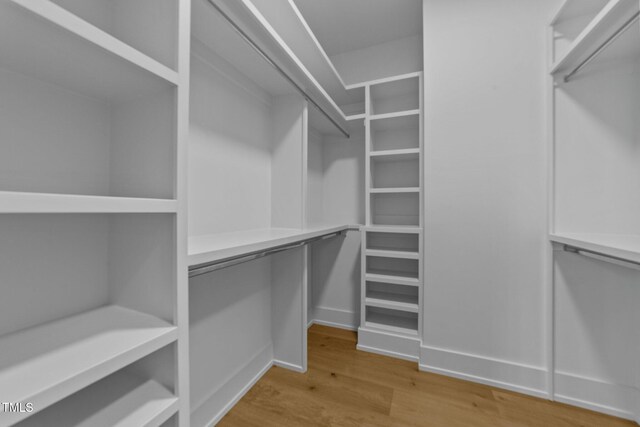 15517 Possum Track Rd, Raleigh, NC 27614 - walk in closet featuring wood finished floors