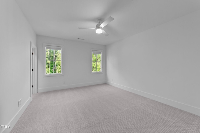 15517 Possum Track Rd, Raleigh, NC 27614 - empty room featuring baseboards, ceiling fan, and light carpet