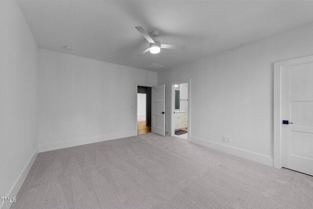 15517 Possum Track Rd, Raleigh, NC 27614 - unfurnished bedroom featuring carpet floors, baseboards, ensuite bath, and ceiling fan