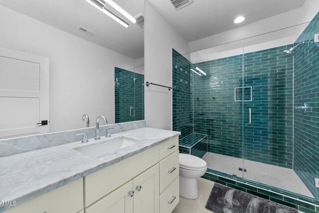 15517 Possum Track Rd, Raleigh, NC 27614 - bathroom with vanity, toilet, a stall shower, and tile patterned floors