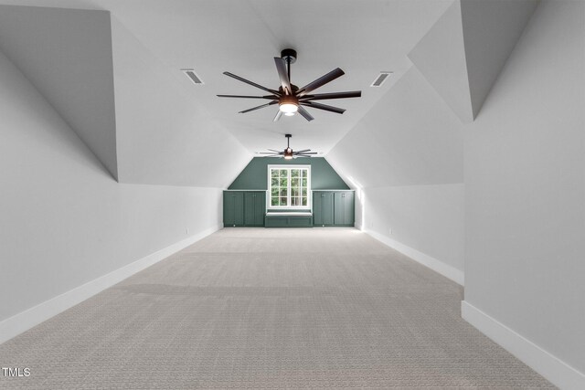 15517 Possum Track Rd, Raleigh, NC 27614 - bonus room with light colored carpet, vaulted ceiling, a ceiling fan, and baseboards