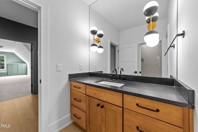 15517 Possum Track Rd, Raleigh, NC 27614 - bathroom featuring vanity, wood finished floors, and baseboards