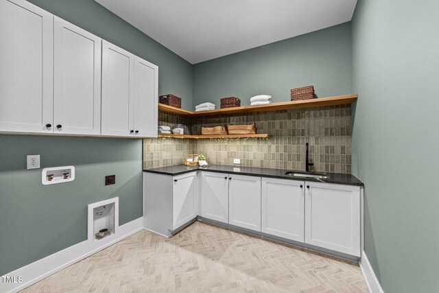 15517 Possum Track Rd, Raleigh, NC 27614 - laundry area featuring cabinet space, electric dryer hookup, hookup for a washing machine, and baseboards