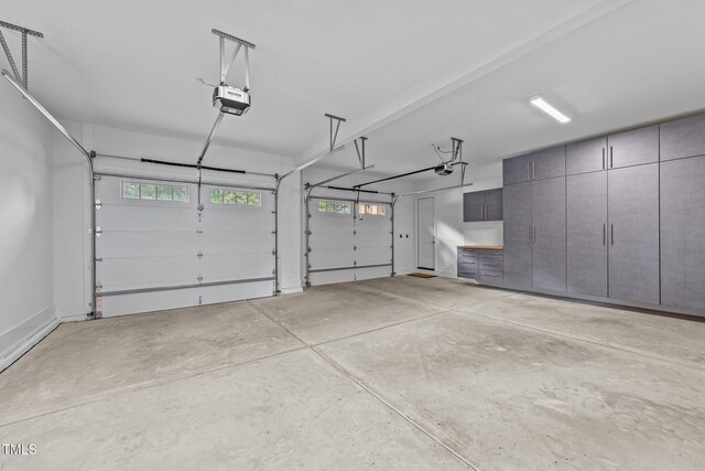 15517 Possum Track Rd, Raleigh, NC 27614 - garage featuring a garage door opener