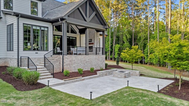15517 Possum Track Rd, Raleigh, NC 27614 - doorway to property featuring a patio area, a yard, and roof with shingles