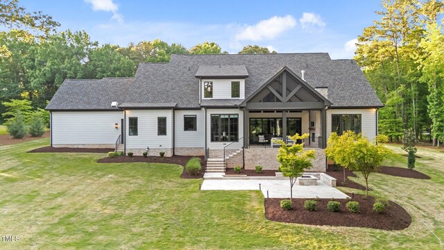 15517 Possum Track Rd, Raleigh, NC 27614 - back of house with a patio area, a yard, and a shingled roof
