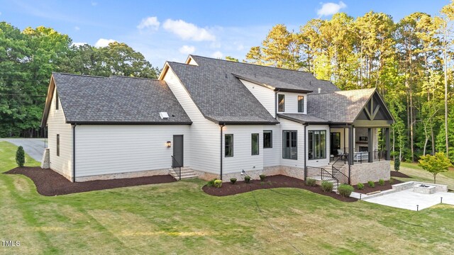 15517 Possum Track Rd, Raleigh, NC 27614 - view of front of property featuring a front yard, a shingled roof, a patio area, and entry steps