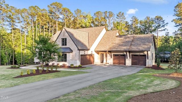 15517 Possum Track Rd, Raleigh, NC 27614 - view of front of house with an attached garage, stone siding, driveway, and a front yard