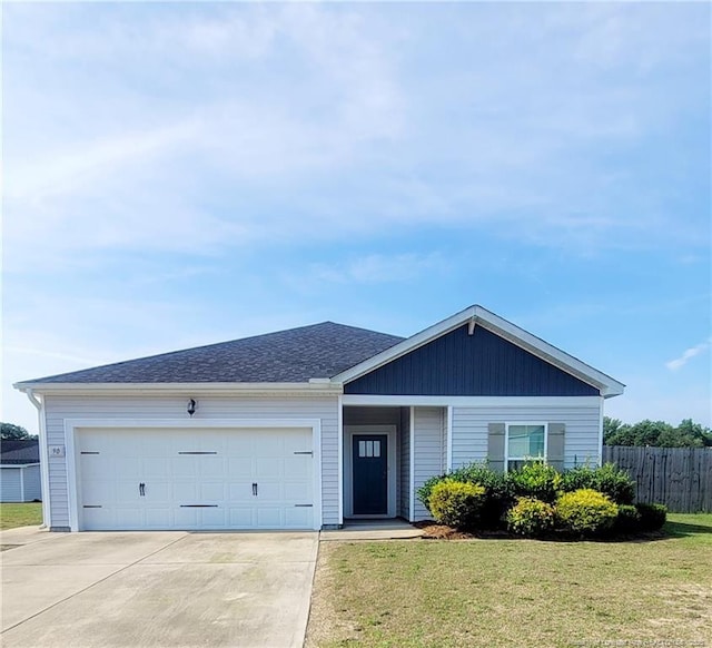 90 Tyson Carriage Ln, Autryville, NC 28318 - ranch-style house with concrete driveway and an attached garage