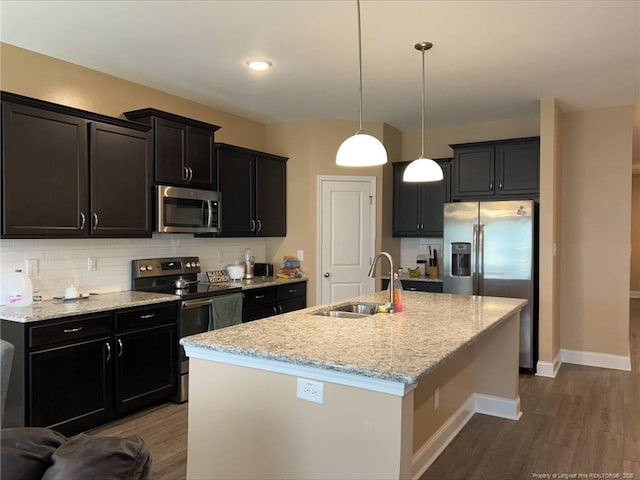 90 Tyson Carriage Ln, Autryville, NC 28318 - kitchen with appliances with stainless steel finishes, a sink, dark wood-style floors, and tasteful backsplash