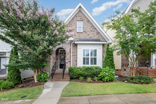 43 Salt Cedar Ln, Chapel Hill, NC 27516 - view of front of home with a front lawn and brick siding