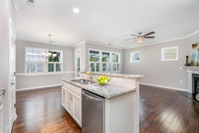 43 Salt Cedar Ln, Chapel Hill, NC 27516 - kitchen featuring dishwasher, a sink, dark wood finished floors, a glass covered fireplace, and light stone countertops