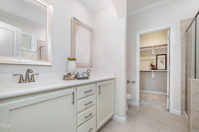43 Salt Cedar Ln, Chapel Hill, NC 27516 - bathroom with a stall shower, toilet, double vanity, crown molding, and a spacious closet