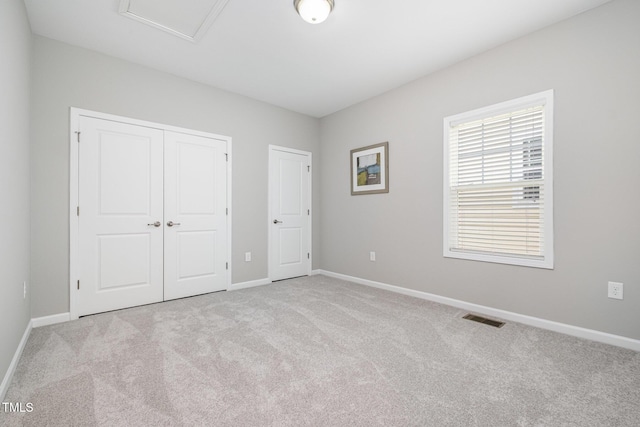 43 Salt Cedar Ln, Chapel Hill, NC 27516 - unfurnished bedroom with carpet, baseboards, a closet, and attic access