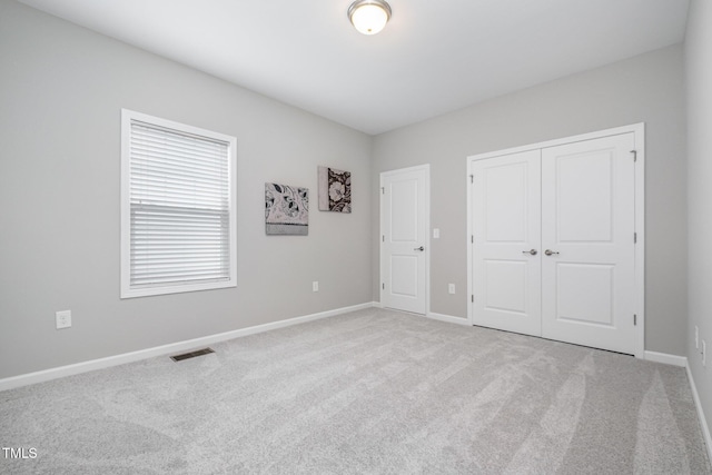 43 Salt Cedar Ln, Chapel Hill, NC 27516 - unfurnished bedroom with carpet floors, baseboards, and a closet