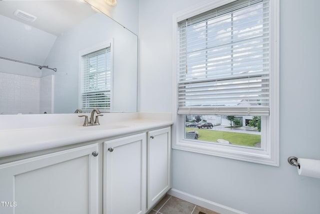 43 Salt Cedar Ln, Chapel Hill, NC 27516 - full bath featuring vanity, tile patterned floors, vaulted ceiling, a shower, and baseboards