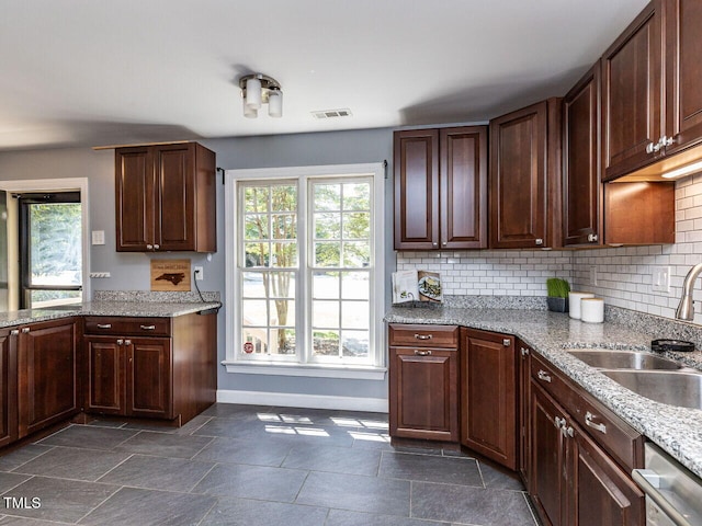102 Sanair Ct, Apex, NC 27502 - kitchen featuring a sink, baseboards, healthy amount of natural light, and decorative backsplash