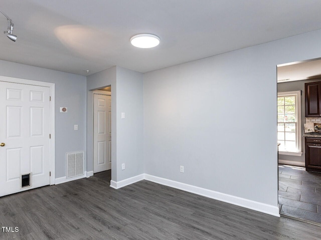 102 Sanair Ct, Apex, NC 27502 - unfurnished bedroom featuring dark wood-type flooring and baseboards