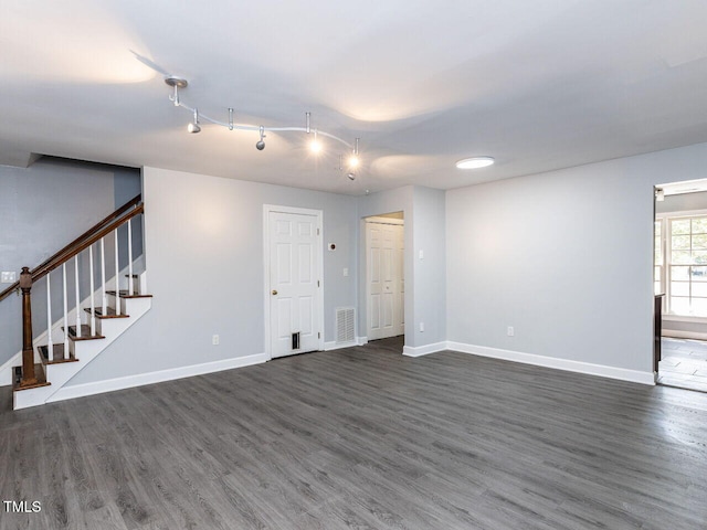 102 Sanair Ct, Apex, NC 27502 - unfurnished living room featuring dark wood-type flooring, baseboards, and stairway