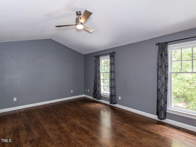 102 Sanair Ct, Apex, NC 27502 - empty room with ceiling fan, lofted ceiling, dark wood finished floors, and baseboards