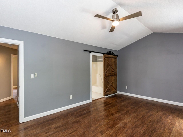 102 Sanair Ct, Apex, NC 27502 - unfurnished bedroom with vaulted ceiling, wood finished floors, a barn door, baseboards, and ceiling fan