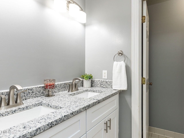 102 Sanair Ct, Apex, NC 27502 - bathroom featuring double vanity, tile patterned floors, and baseboards